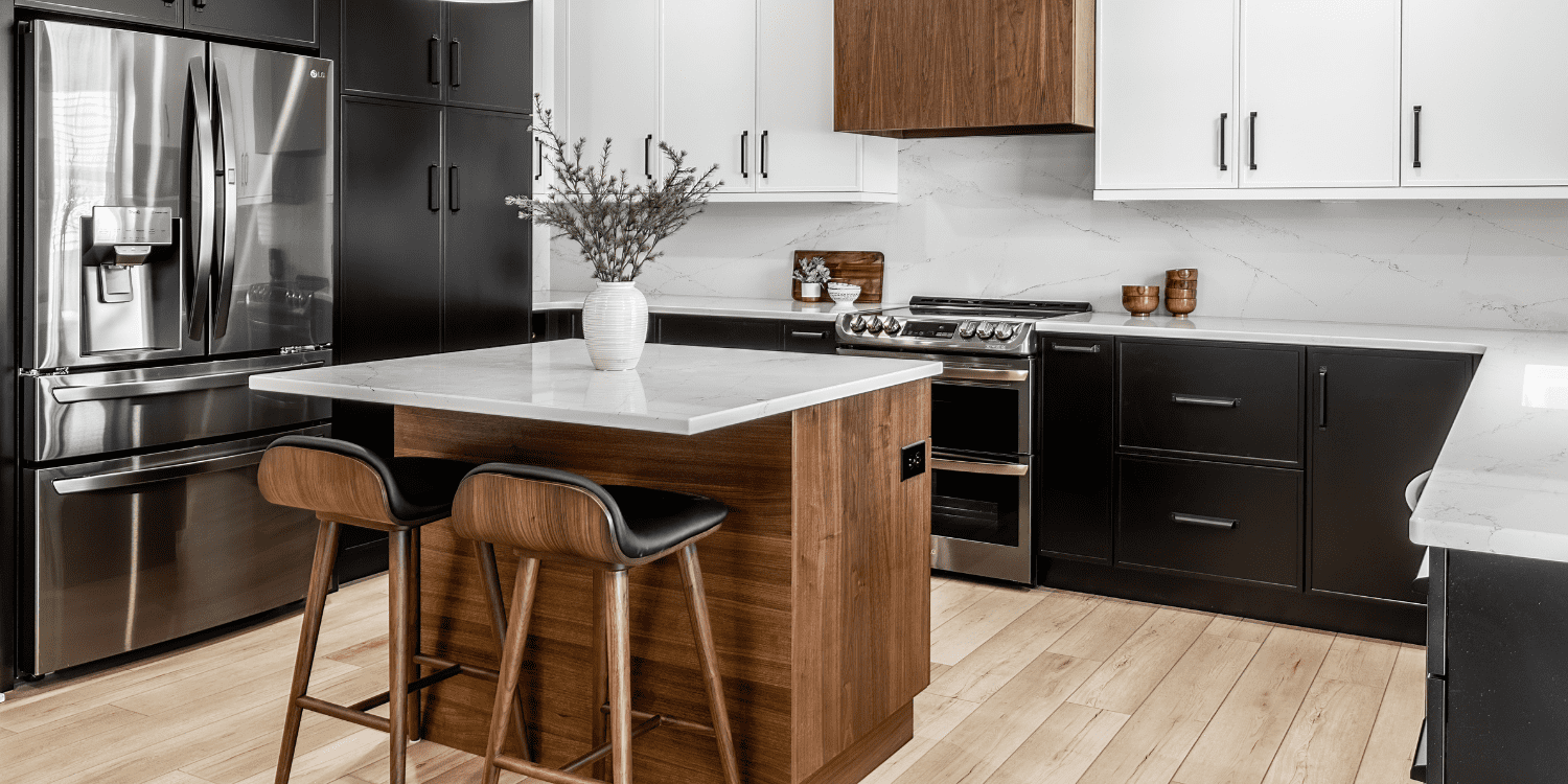 Stock Image of Kitchen Remodel with Black and White Cabinets and Wood Island