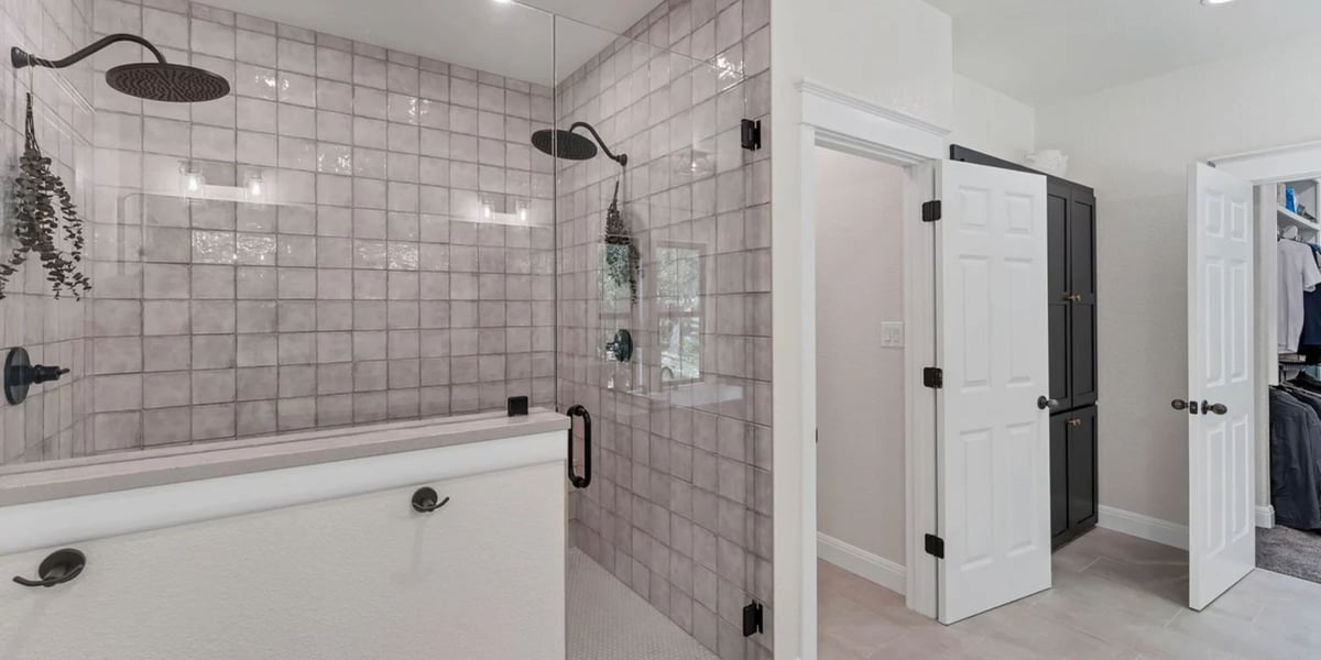 Contemporary bathroom remodel in San Antonio with tiled walk-in shower by Hill Haven Homes