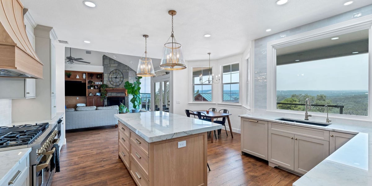 San Antonio kitchen remodel with marble island and panoramic window views by Hill Haven Homes
