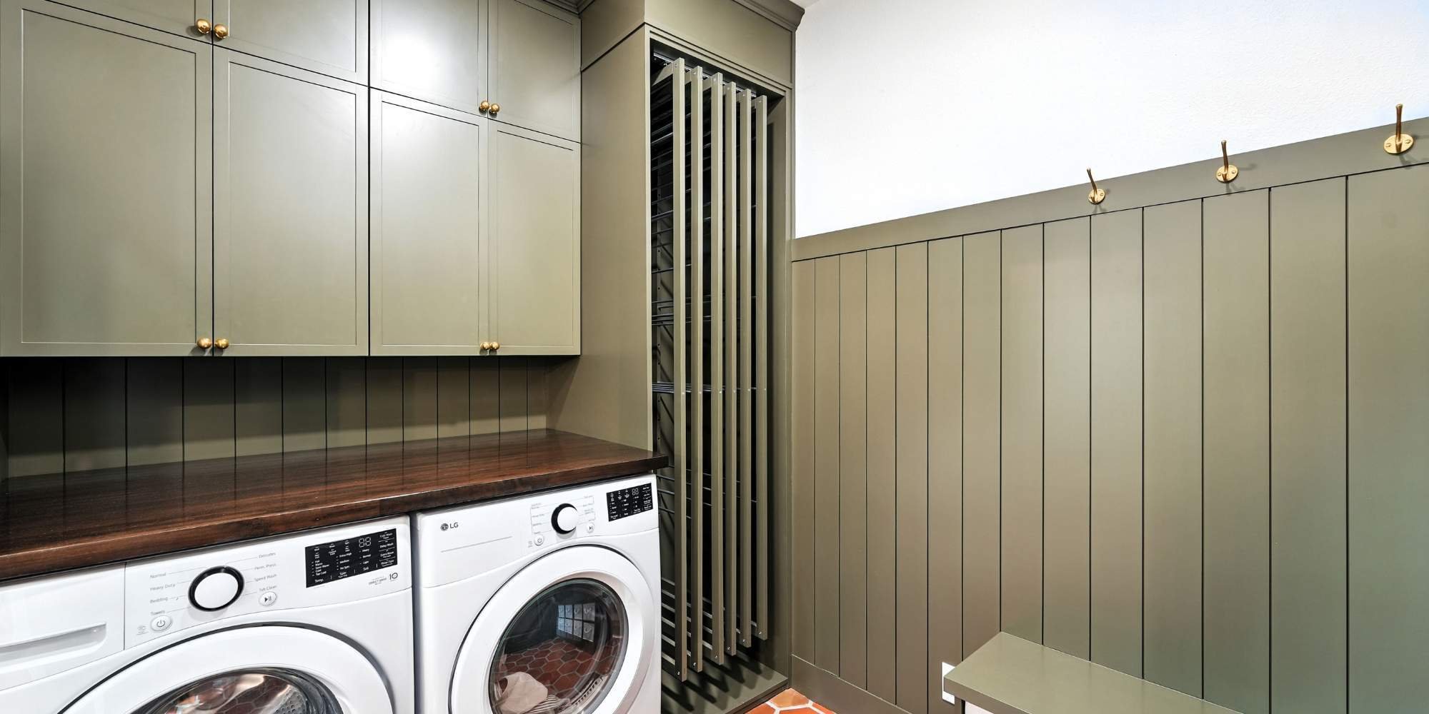 Laundry remodel in San Antonio with custom cabinetry and washer-dryer setup