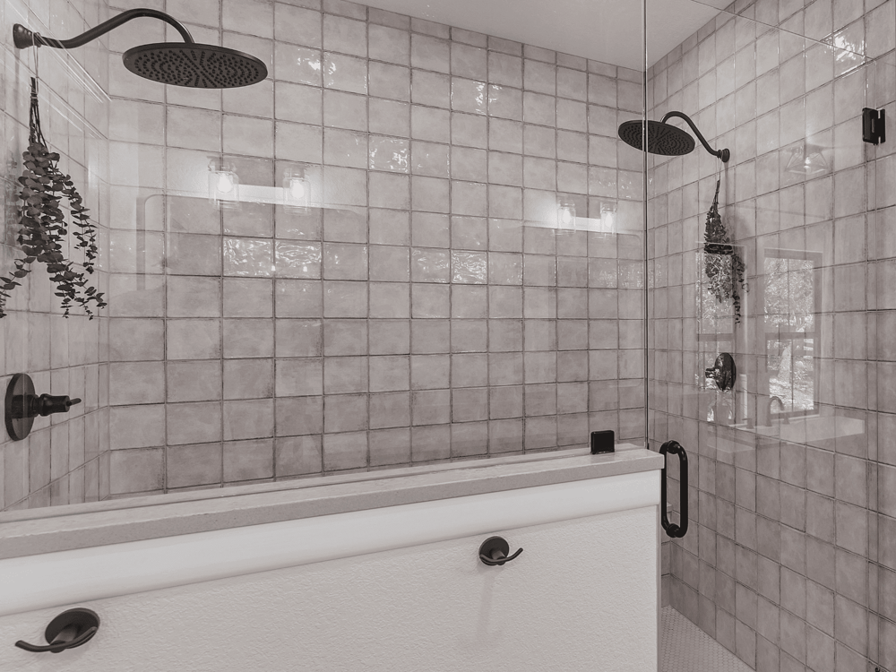 Tiled Shower With Double Showerheads and Half Wall in Bathroom Remodel in Bulverde