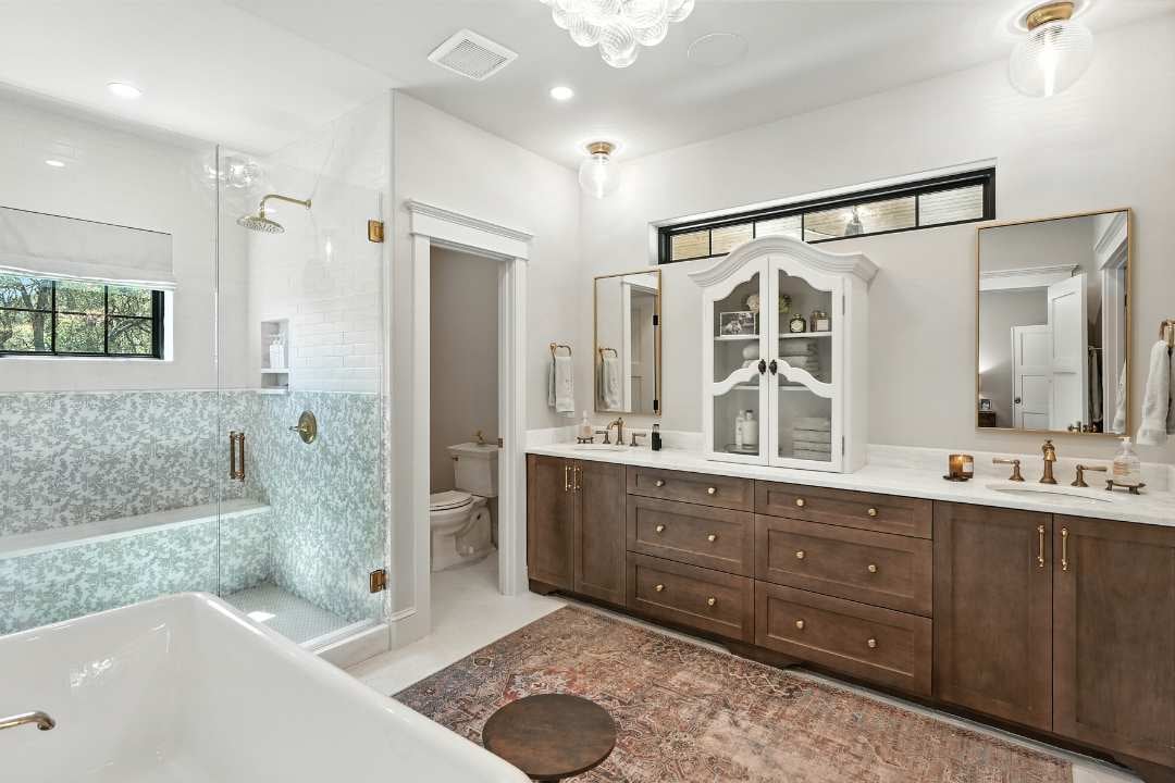 Bathroom remodel with dual sinks, walk-in shower, and custom vanity in San Antonio by Hill Haven Homes