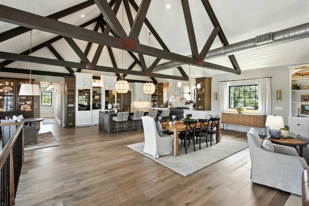 Spacious open-concept remodel with vaulted ceilings, wood beams, and a modern kitchen in San Antonio by Hill Haven Homes