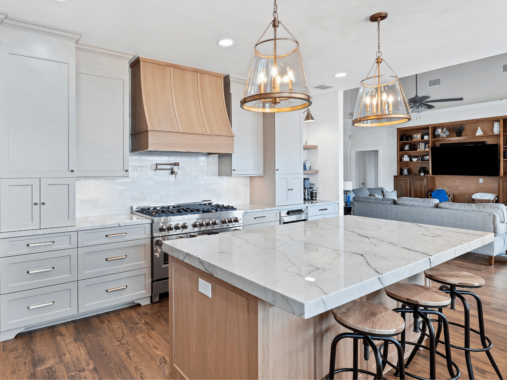 Off White Kitchen with Warm Natural Wood Accents in Large Island in San Antonio