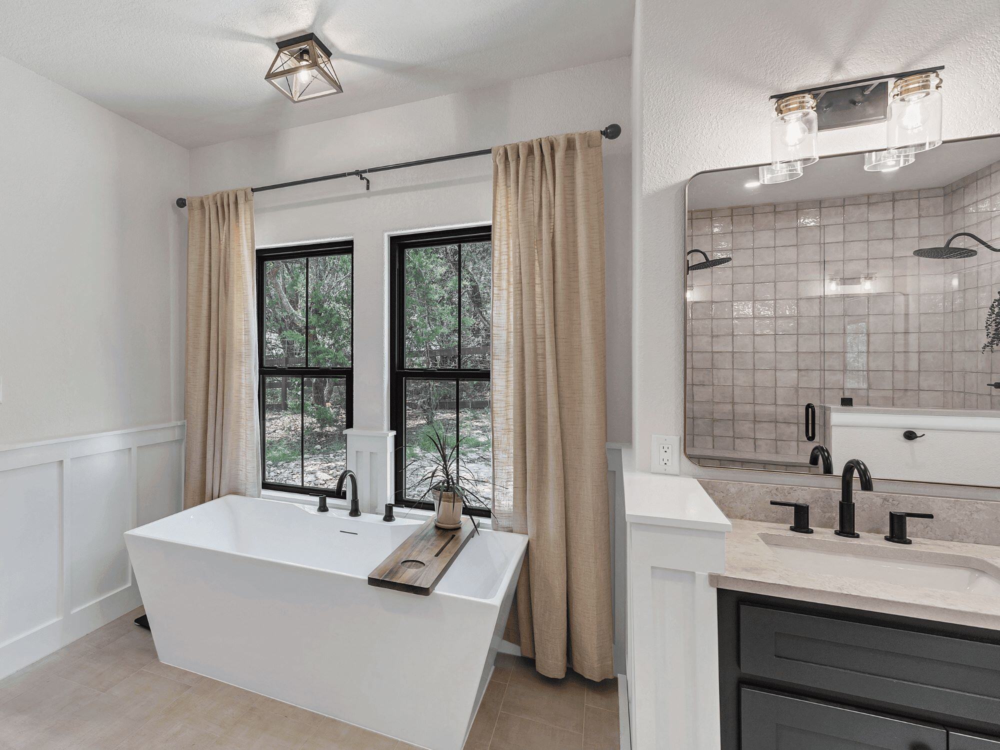 Soaking Tub Next to Windows in Large Bathroom Renovation