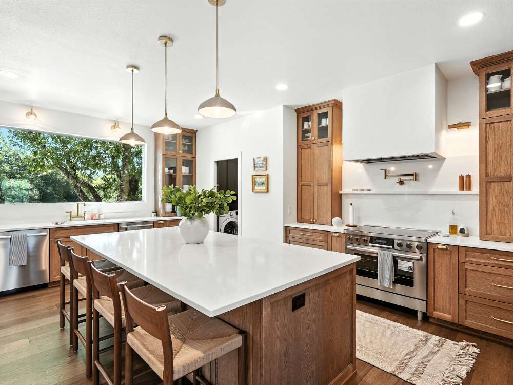Hill Haven Homes kitchen remodel with large island and wood cabinetry in San Antonio Hill Haven Homes kitchen remodel with large island and wood cabinetry in San Antonio