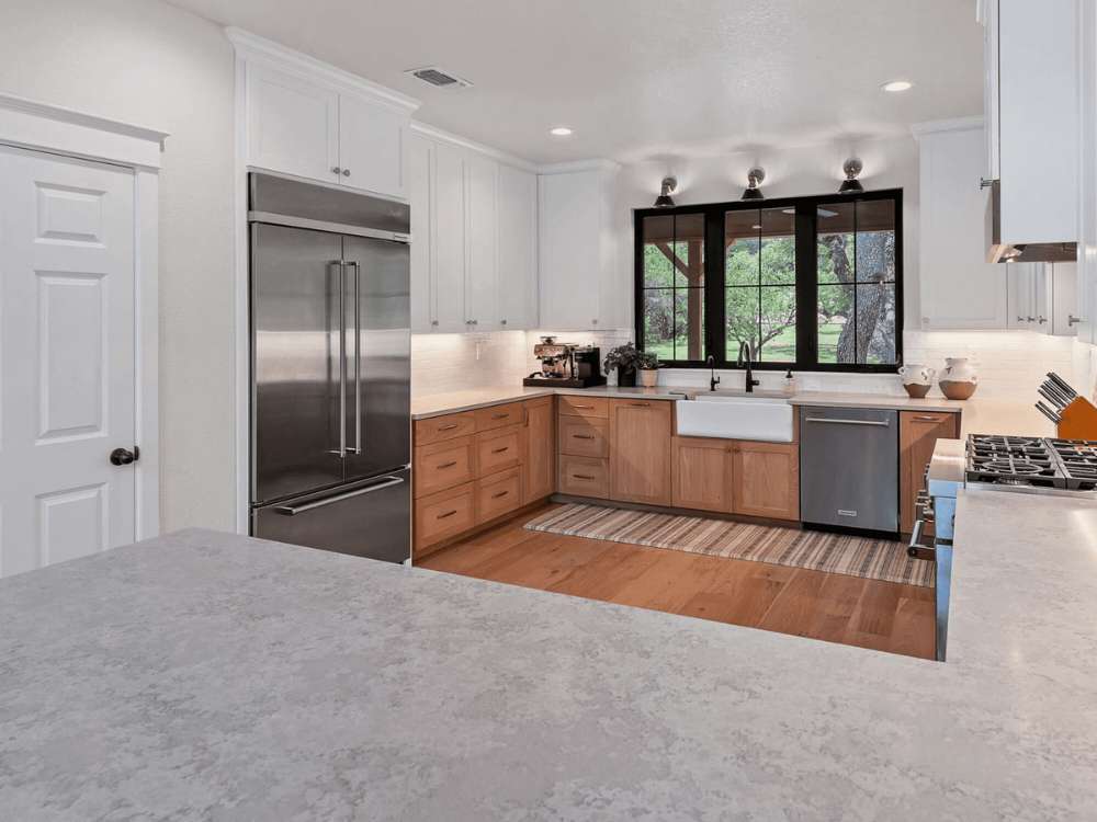 Updated kitchen with black window trim and custom cabinetry in Spring Branch by Hill Haven Homes