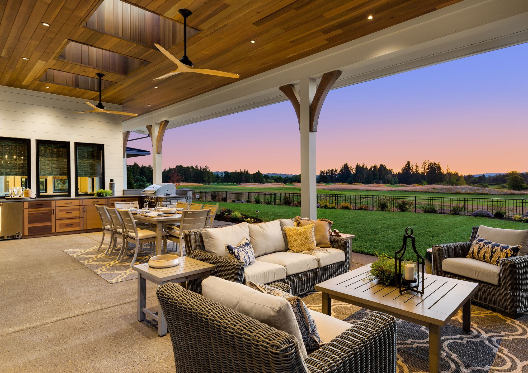 Outdoor Kitchen on Porch with Seating and Dining Areas 